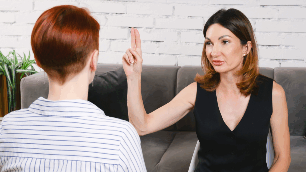 Woman leads EMDR therapy, moving two fingers in front of client. Trauma therapy in Los Angeles, CA is just a click away—visit the Kindful Body website for details.
